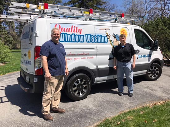 Crew standing in front of van